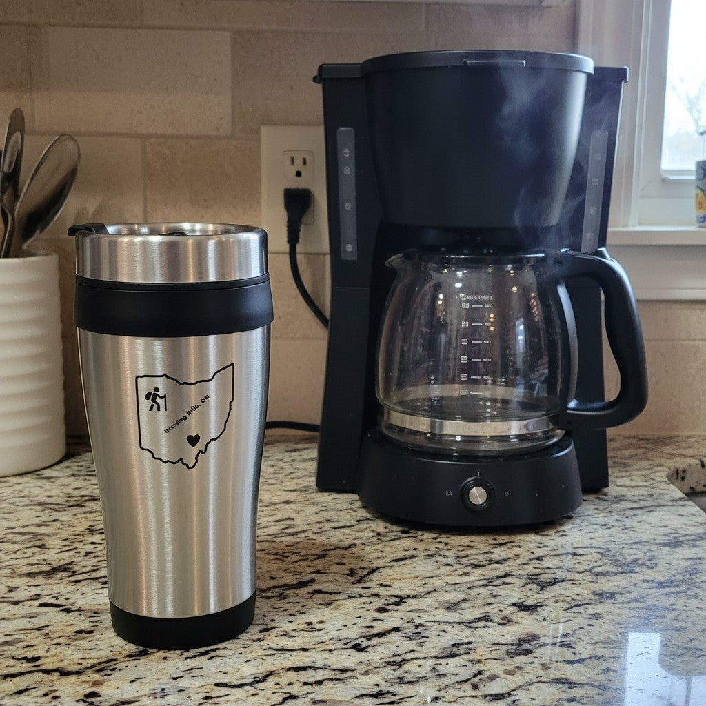 The Hocking Hills Store stainless steel travel mug with black lid and grip, featuring an Ohio outline graphic.