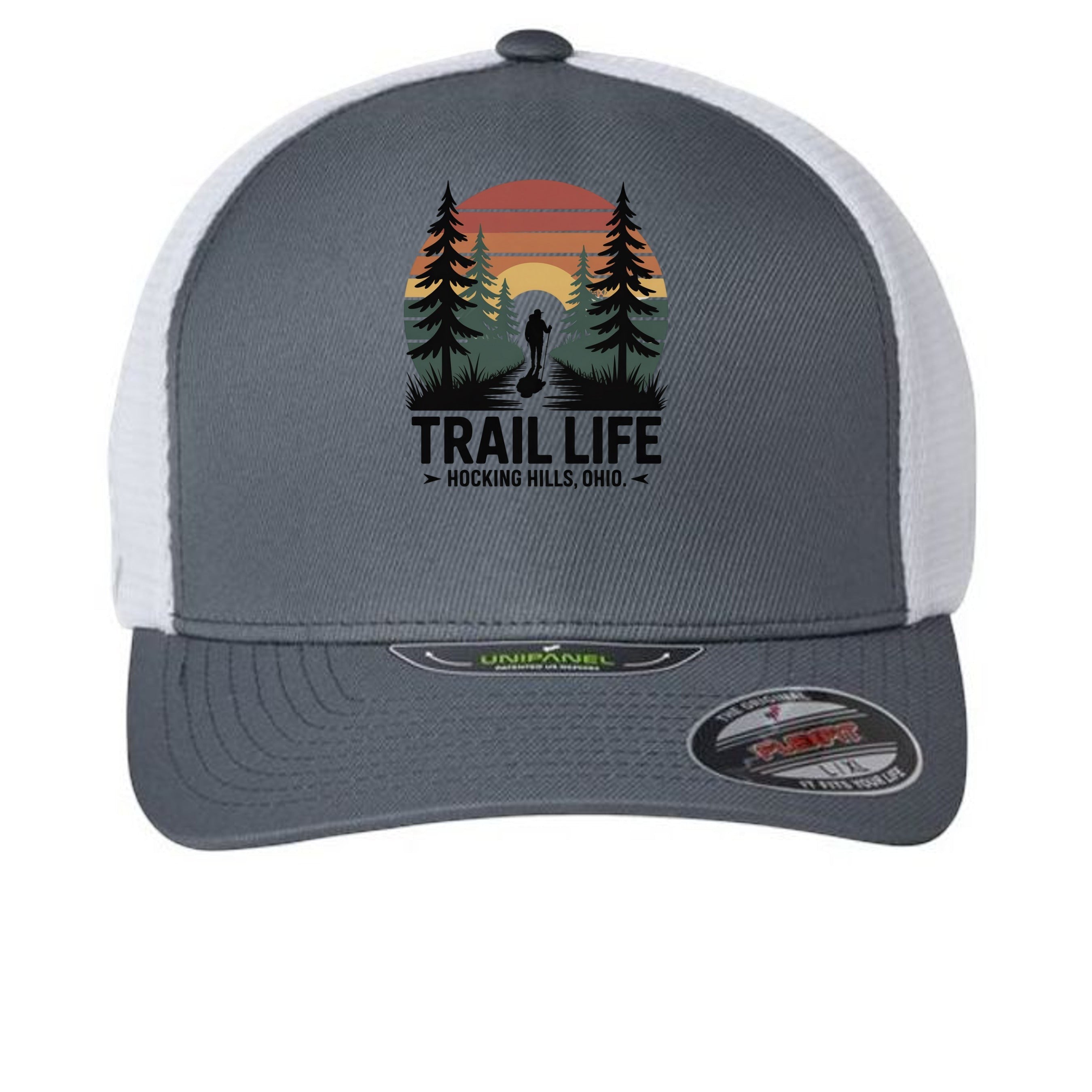 The Hocking Hills Store fitted trucker hat with a graphic of a hiker in a forest at sunset and "TRAIL LIFE" text.