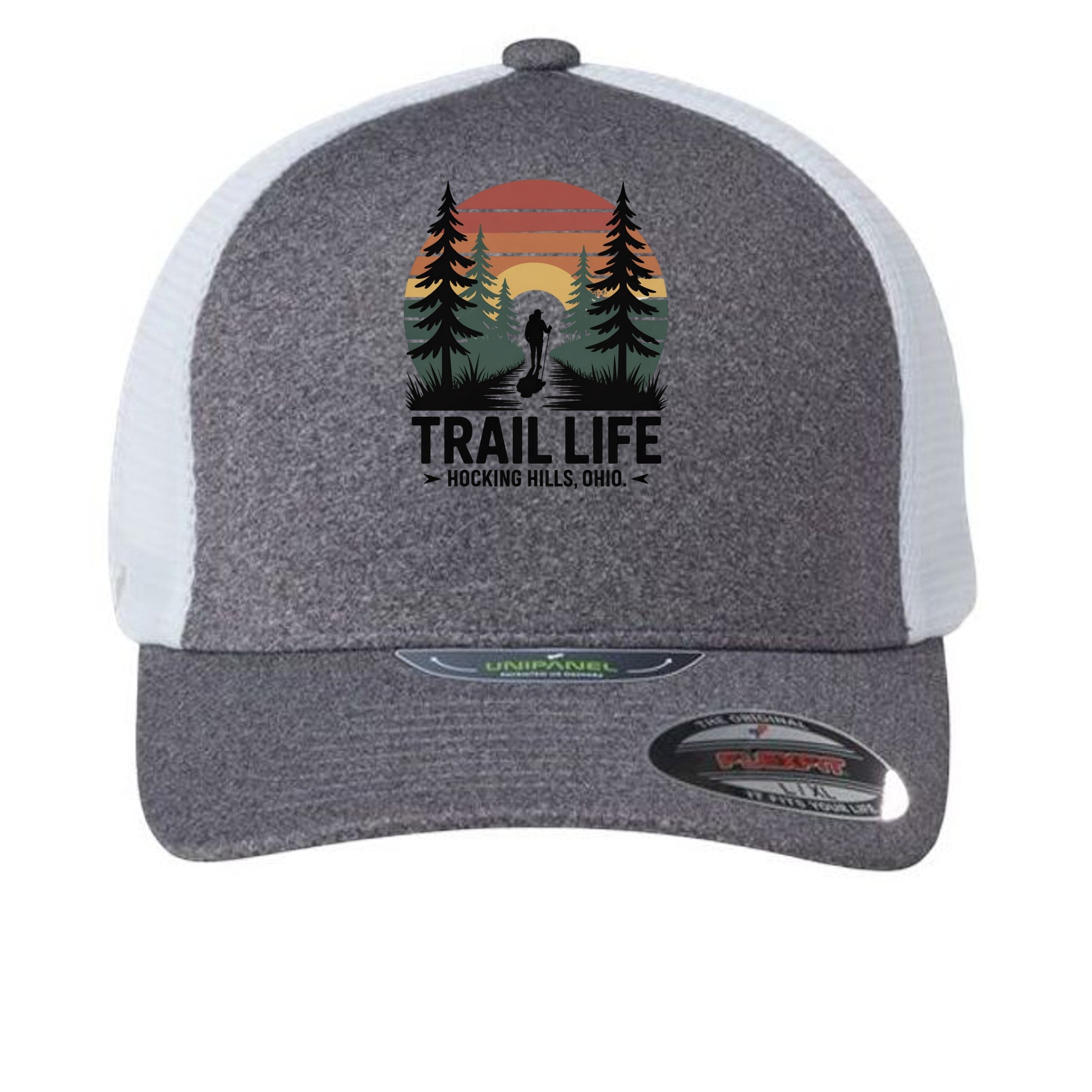 The Hocking Hills Store fitted trucker hat with a graphic of a hiker in a forest at sunset and "TRAIL LIFE" text.