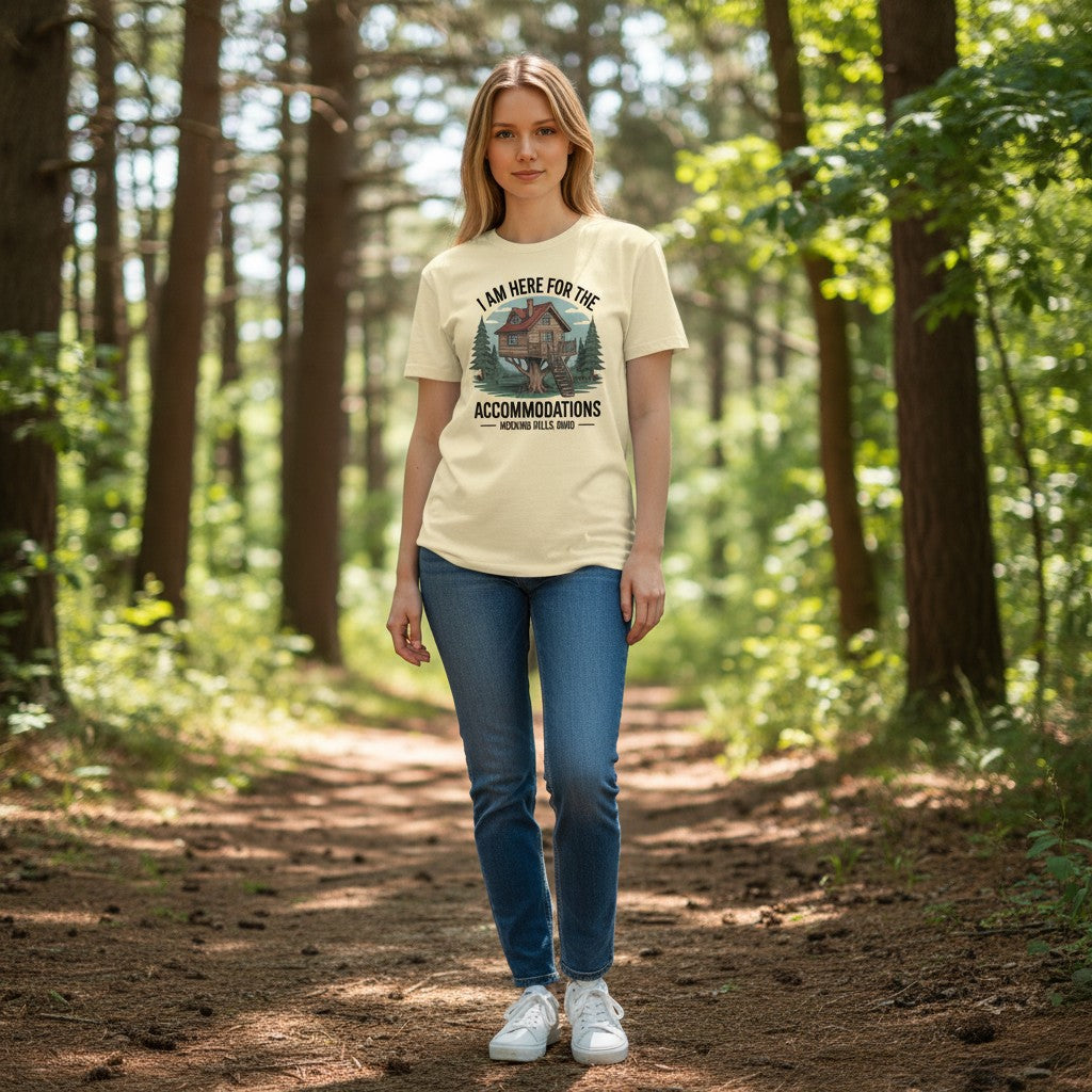 The Hocking Hills Store unisex triblend tee in cream features a graphic of a treehouse with the text "I Am Here for the Accommodations Hocking Hills, Ohio."