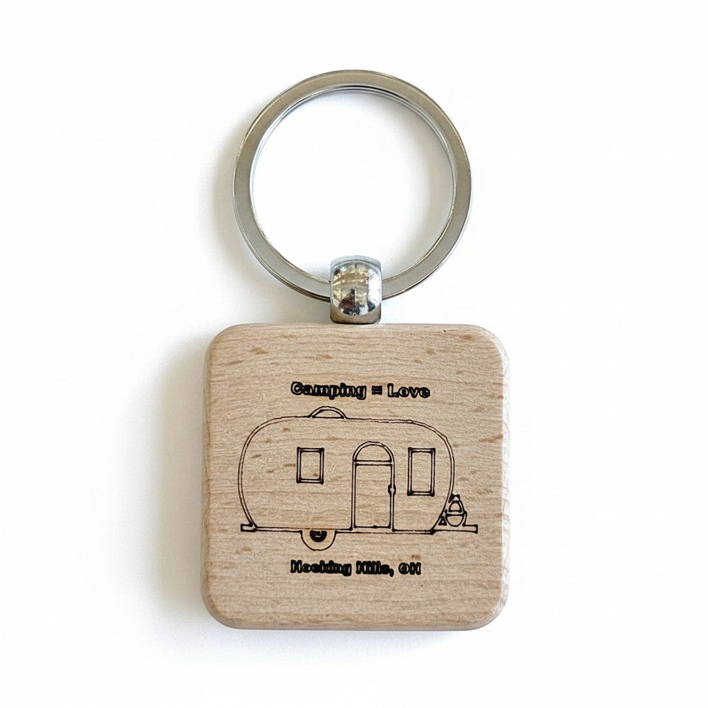 The Hocking Hills Store wood keychain with laser engraved camper and text "Camping = Love Hocking Hills, OH".