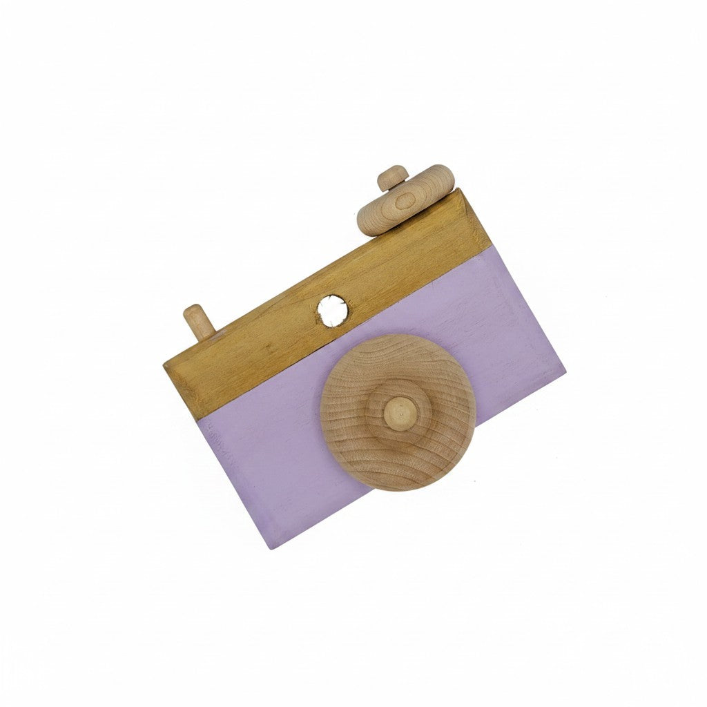 The Hocking Hills Store handmade wooden toy camera with lavender accents and wooden wheels. Features a lens opening and two wooden knobs.