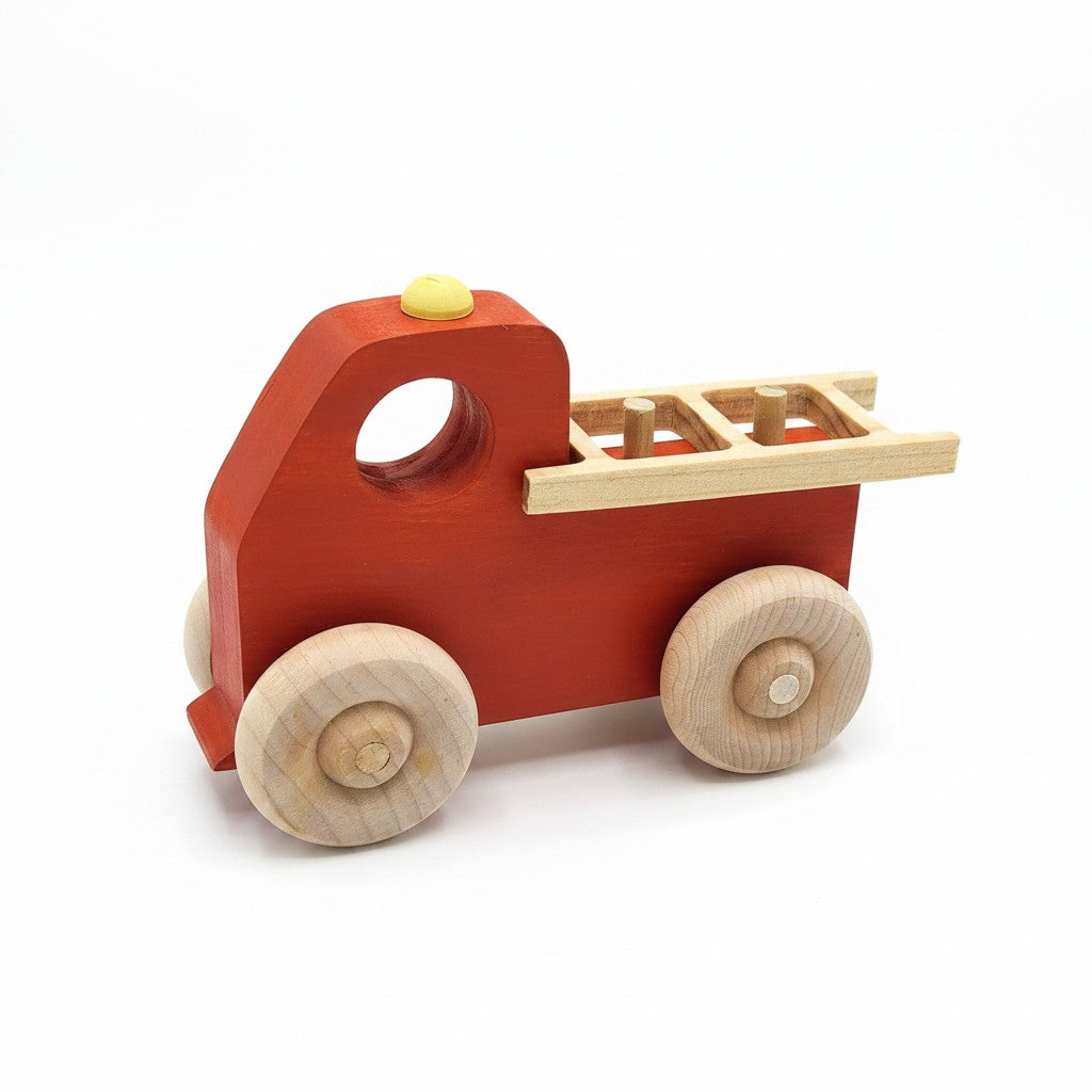 The Hocking Hills Store handmade red wooden toy fire truck with natural wood wheels and ladder detail.