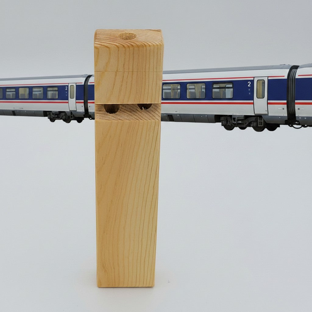 The Hocking Hills Store handmade wooden toy train whistle. Natural wood grain, two holes for sound.