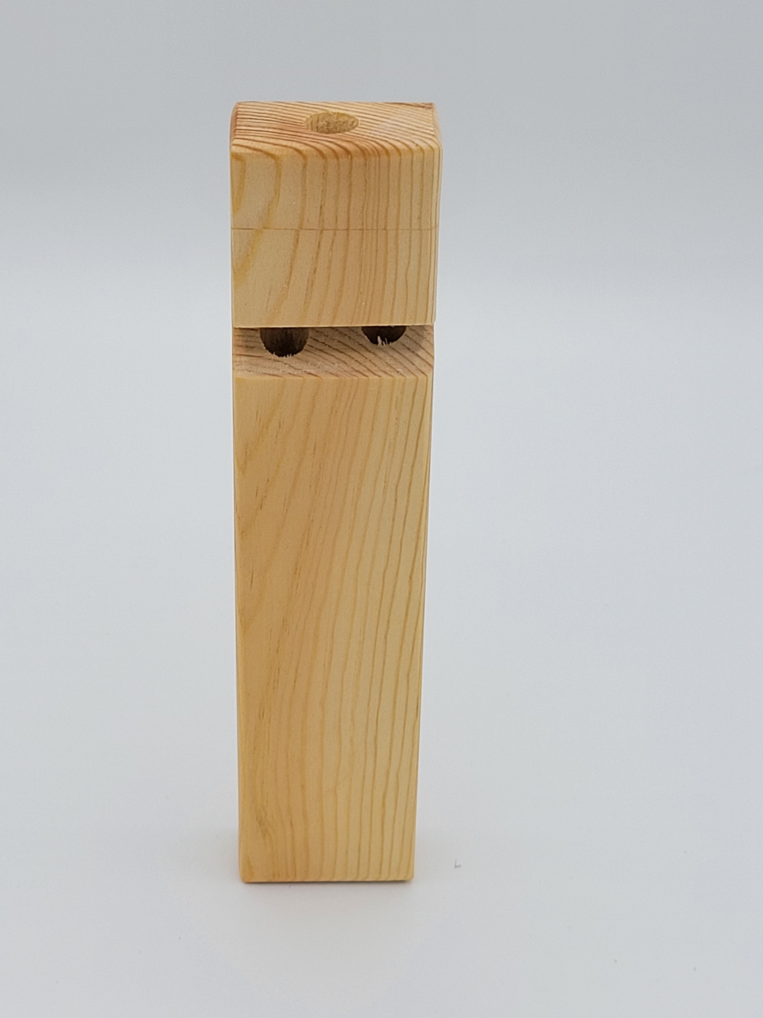 The Hocking Hills Store handmade wooden toy train whistle. Natural wood grain, two holes for sound.