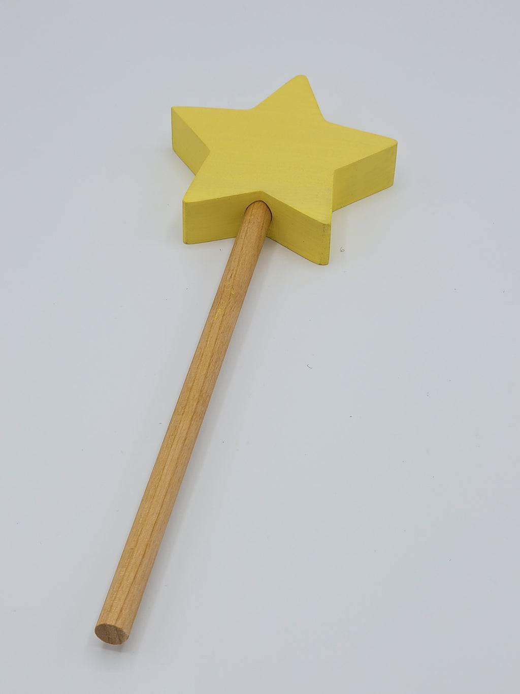 The Hocking Hills Store yellow wooden star toy wand for imaginative play.