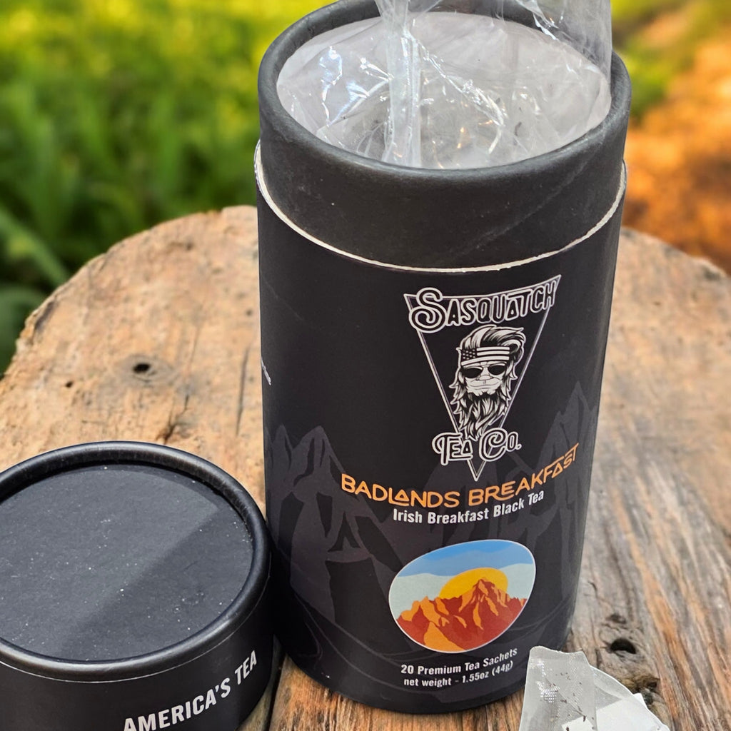The Hocking Hills Store Sasquatch Tea Co. Badlands Breakfast Irish Black Tea in a black cylinder with mountain graphics.