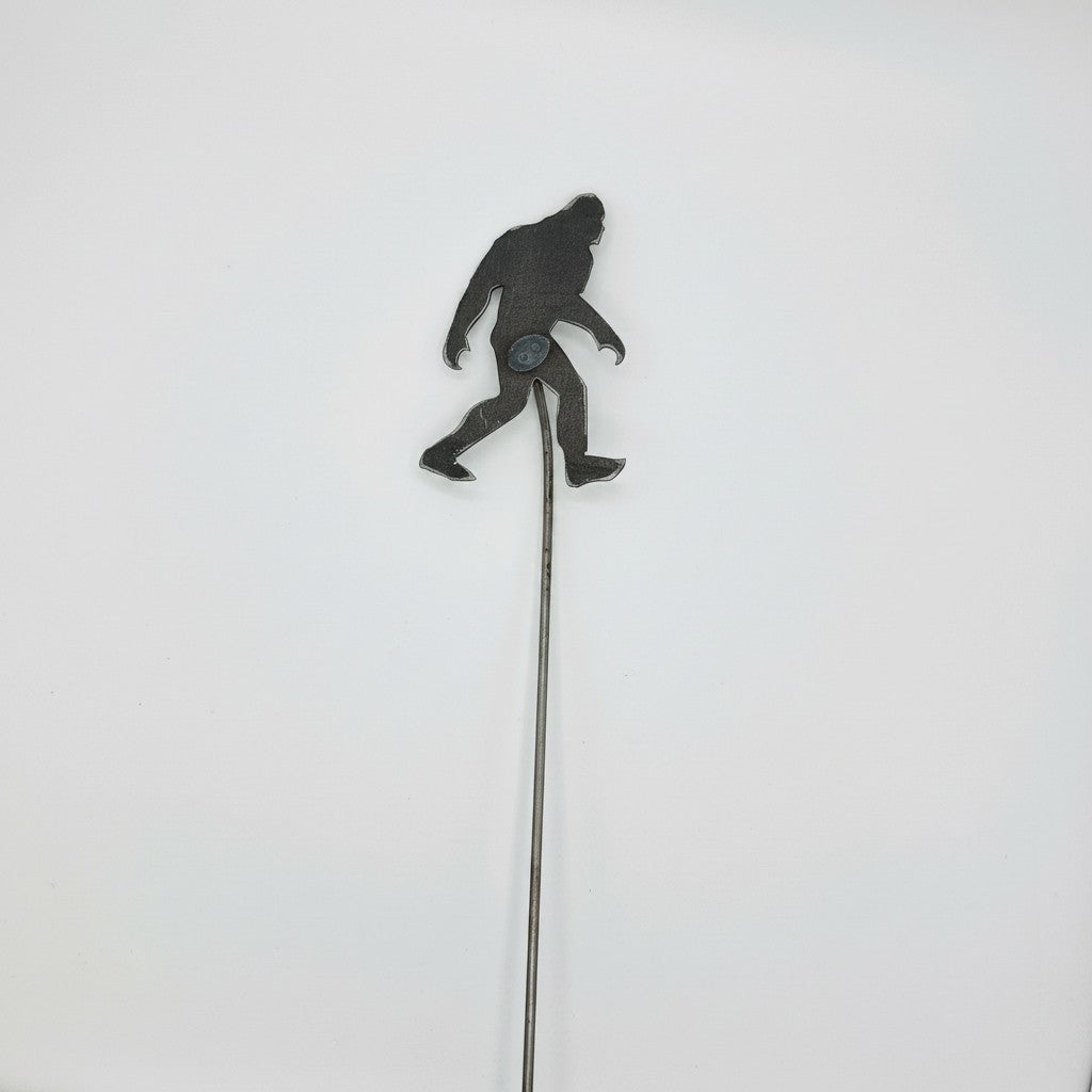 The Hocking Hills Store Bigfoot metal garden stake, dark grey silhouette on a thin metal rod.
