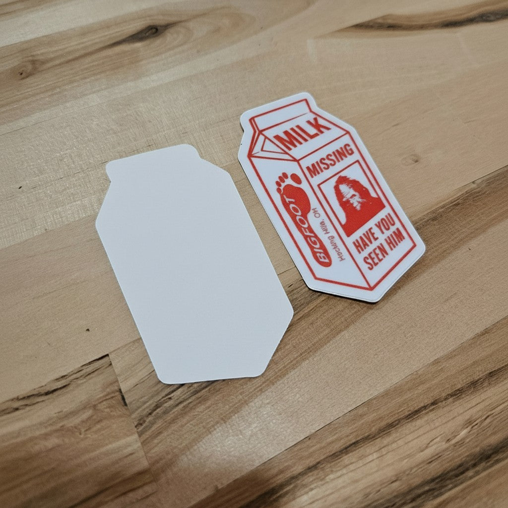 The Hocking Hills Store Bigfoot Missing bumper sticker designed like a milk carton with red text and graphics. Features a Bigfoot silhouette.