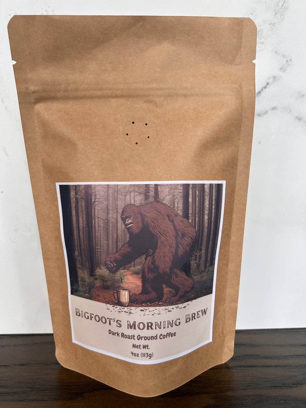 The Hocking Hills Store Bigfoot's Morning Brew dark roast ground coffee in a 4oz bag with a Bigfoot illustration.